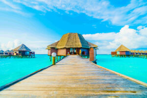 Beautiful tropical Maldives resort hotel and island with beach and sea on sky for holiday vacation background concept -Boost up color Processing